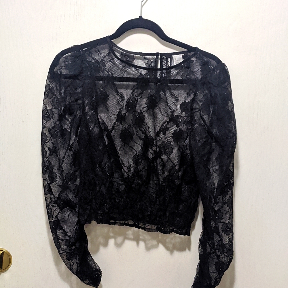 Divided black sheer top